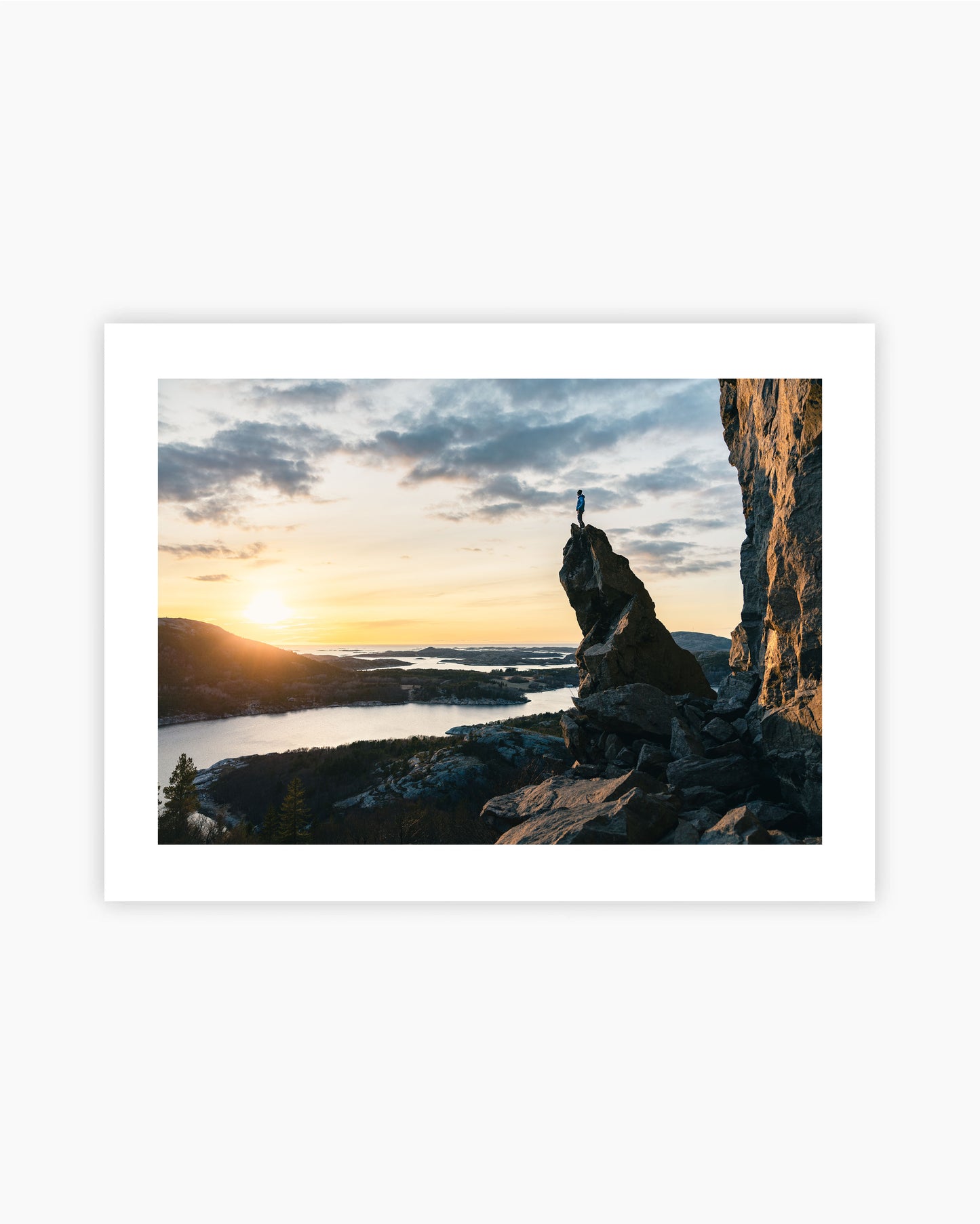 Print of Adam Ondra on top of the spire in Flatanger, Norway.