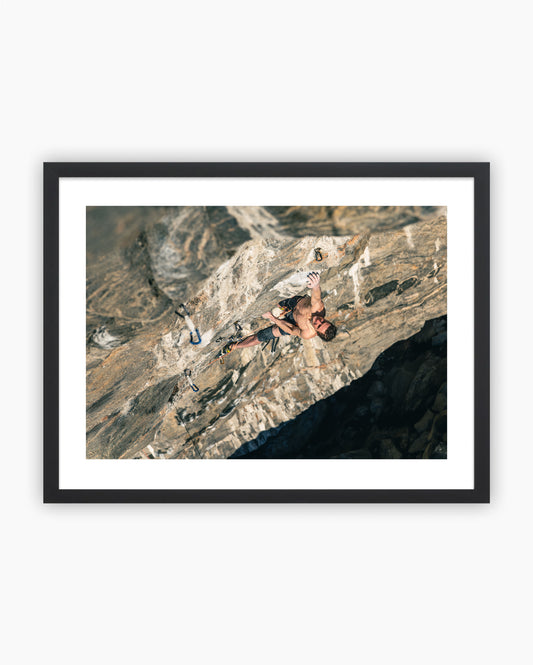 Framed print of Adam Ondra climbing Project B.I.G. in Flatanger, Norway.