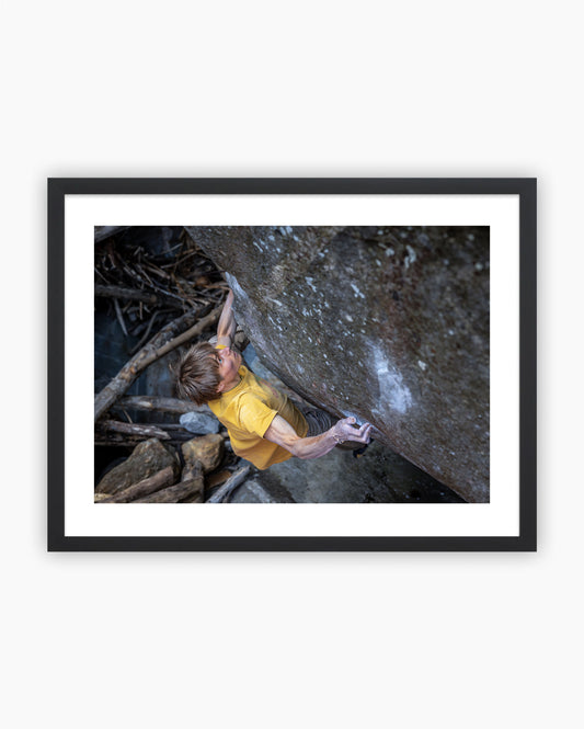 Framed print of Alex Megos climbing Casavino 8B+ in Brione, Switzerland.