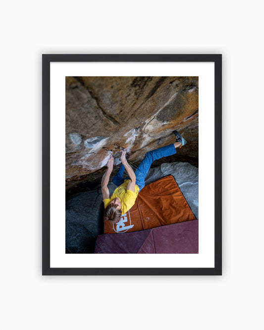 Framed print of Alex Megos climbing Frogger 8A in Brione, Switzerland.