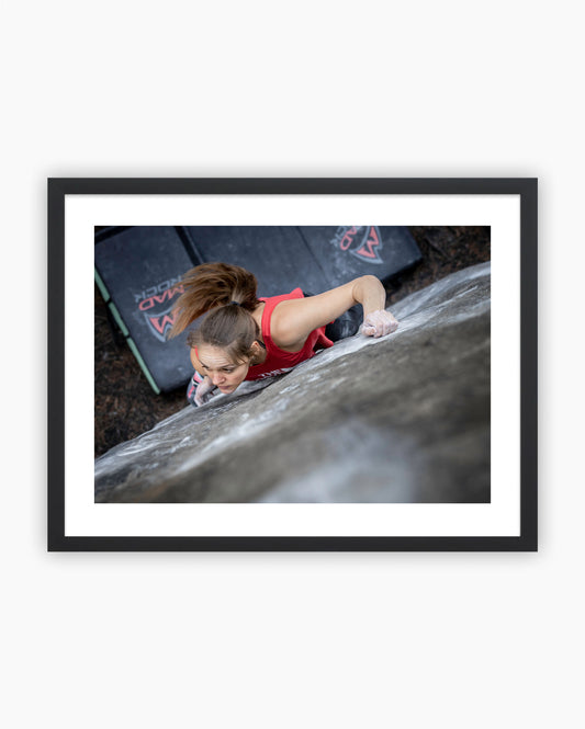 Framed print of Eva Hammelmueller climbing Duel 8A in Fontainebleau, France.
