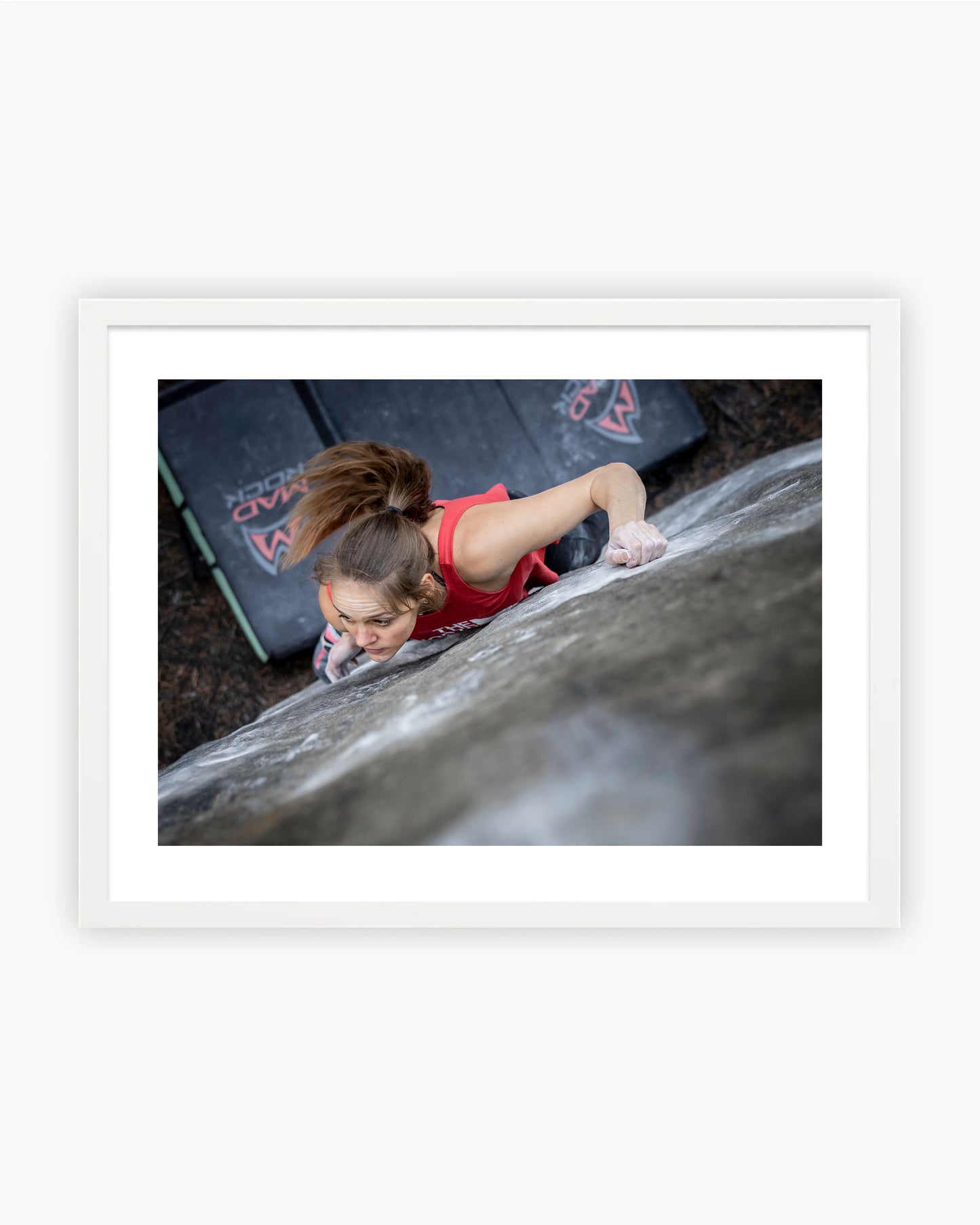 Framed print of Eva Hammelmueller climbing Duel 8A in Fontainebleau, France.