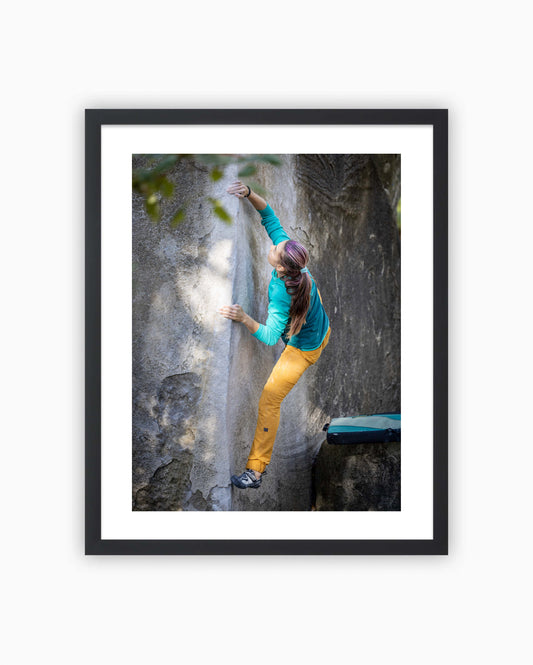 Framed print of Jenya Kazbekova climbing L’Angle Ben’s boulder. Fontainebleau, France 2021.